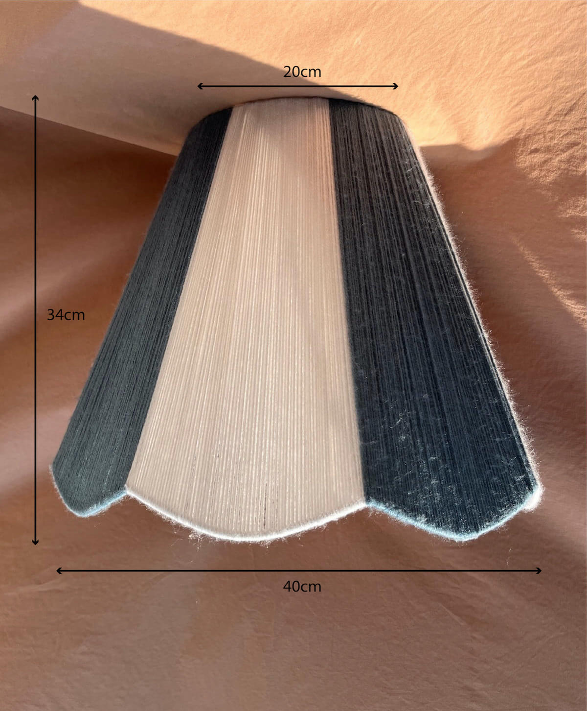 A Slice Shades scallop yarn lampshade with vertical stripes of off-white and slate blue with dimensions.
